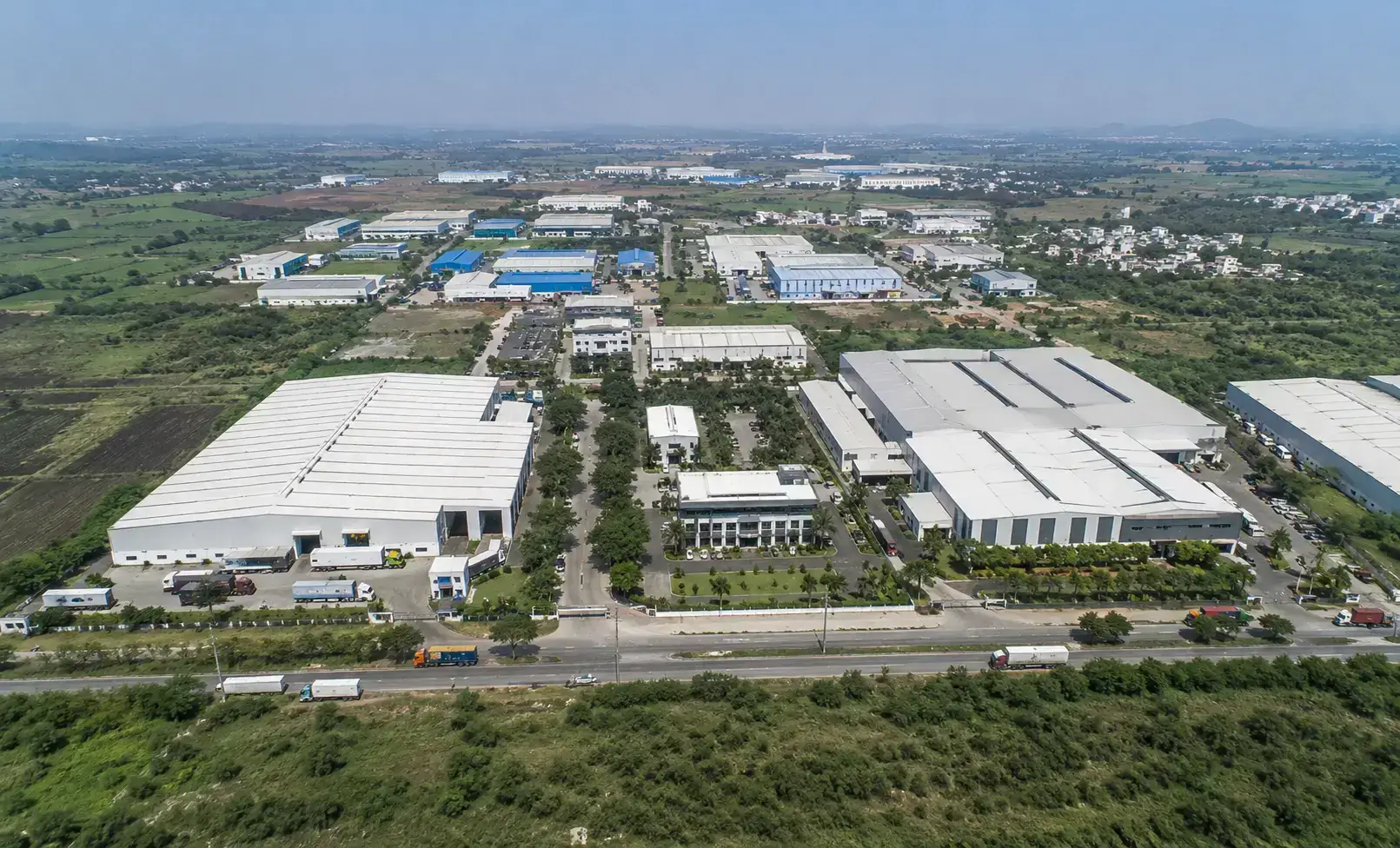 Aerial view of manufacturing units and industrial infrastructure along the Pune-Nagar Road in the Koregaon Bhima industrial belt.