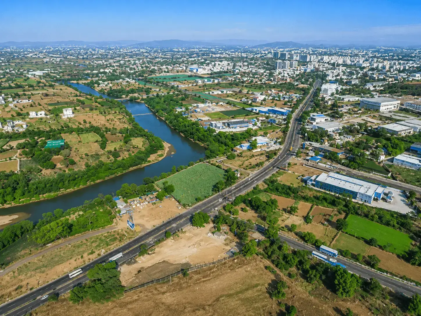 Modern commercial office buildings and corporate campuses within the Talawade MIDC IT Park in Pune.