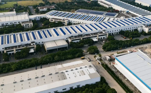 Aerial view of manufacturing facilities and modern infrastructure in the PCMC Industrial Corridor.